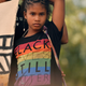 A participant is seen onstage during the LA Pride Resist March on June 11, 2017, in West Hollywood, Calif.